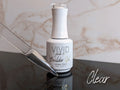 Vivid nail builder gel bottle with a swatch on a marble surface