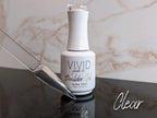 Vivid nail builder gel bottle with a swatch on a marble surface